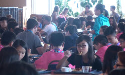 Summer course students eating in hall